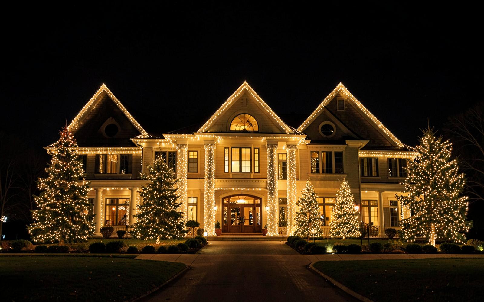 Large custom holiday lighting display on a multi-peak home